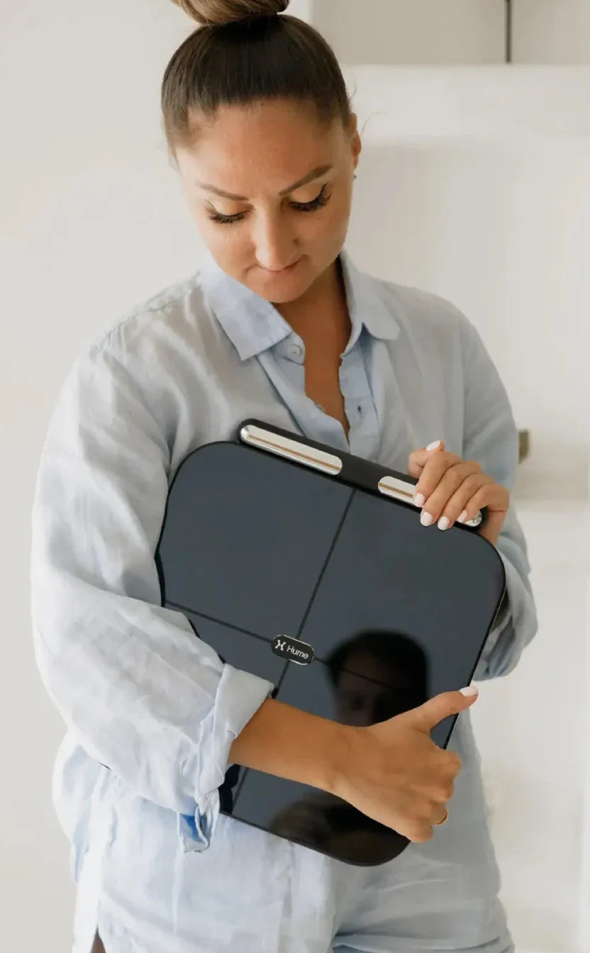 Person holding Hume body composition pod